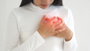 Woaman touch her chest.PNG