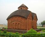 A brick temple with a domed roof