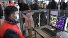 Staff monitoring passengers' body temperature in Wuhan railway station during the Wuhan coronavirus outbreak.jpg