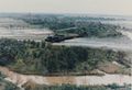 A U.S. helicopter spraying Agent Orange on a jungle during the حرب ڤيتنام,