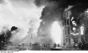 Smoke, fire, and ruins of a city