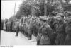 Nazi and Soviet soldiers standing together shoulder to shoulder during the parade