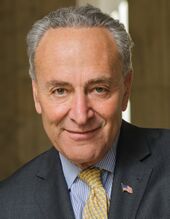 Chuck Schumer smiling in an outdoor photo