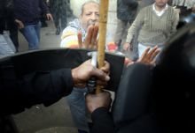 On the second day of protests, demonstrators were still mostly peaceful, but security forces more quickly resorted to violence and physical coercion. Here, riot police confront a protester