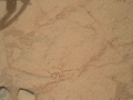 "Ekwir_1" rock on Mars – cleaned with Curiosity's "Dust Removal Tool" (DRT) (January 6, 2013; closeup).