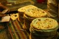 Naan being freshly prepared in a tandoor in Karachi, Pakistan