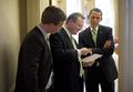 President Obama talks with Gibbs (middle) in the White House. (3/17/09)