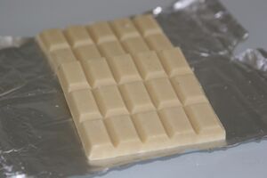 White chocolate bars on foil
