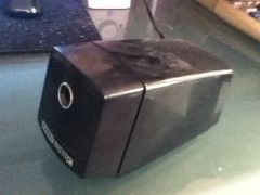An electric pencil sharpener. The mechanism is similar to the planetary sharpener, except there is a motor instead of a crank