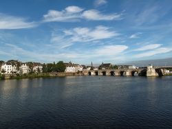 View of Maastricht city centre with its partly medieval bridge on the Meuse river