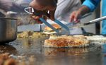An Indian Muslim vendor prepares food at a roadside stall in preparation for Muslims breaking their fast at sundown in Mumbai, India on August 19, 2010. (SAJJAD HUSSAIN/AFP/Getty Images)
