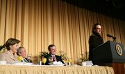 President George W. Bush, Laura Bush and Sen. Mark Pryor (D-Ark.) break out in laughter as Bono speaks during the National Prayer Breakfast at the Washington Hilton, 2006.
