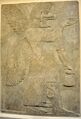 Wall relief depicting an eagle-headed and winged man, Apkallu, from Nimrud.