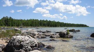 View of rocky shore of Lake Huron from east of Port Dolomite, Michigan, in the upper peninsula