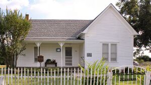 White painted house with garden