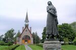 Grand Pré memorial church and statue of Évangeline.