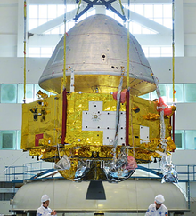 The Tianwen-1 orbiter (below) and the capsule housing the lander and Zhurong rover (top).