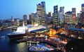 The QE2 docked at Sydney Harbour, looking towards Circular Quay and the Sydney CBD.
