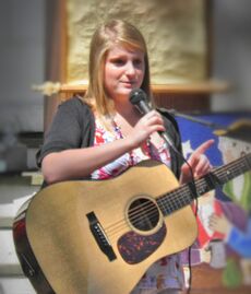 Meghan Trainor performing outside a church in 2010