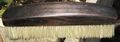 An ebony clothes brush.