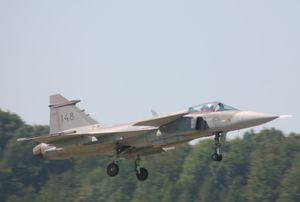 Gray jet aircraft taking off