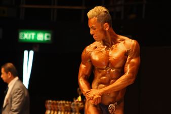 A bodybuilder who has been suntanning.