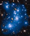 The galaxies that are not coloured blue are either in the foreground or background and are not part of the cluster.[5]