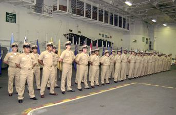 U.S. Navy sailors dressed in khaki at a ceremony. The word khaki means "earth" in the Persian language.