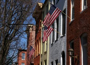 Brick rowhouses with flags