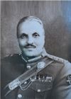 Muhammad Zia-ul-haq in black Sherwani, looking towards the camera