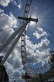 The London Eye silhouetted against the mid-day sun.