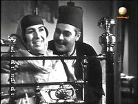 يحيى شاهين وآمال زايد في مشهد من فيلم بين القصرين.jpg