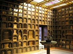 Interior of columbarium at Chapel of the Chimes in Oakland, California. Some of the cinerary urns are book-shaped.