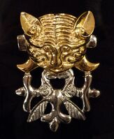 Catlike predator with protomas of two elk, burial mound Berel (IV.-III. BCE) Kazakhstan, Pazyryk culture.[8]